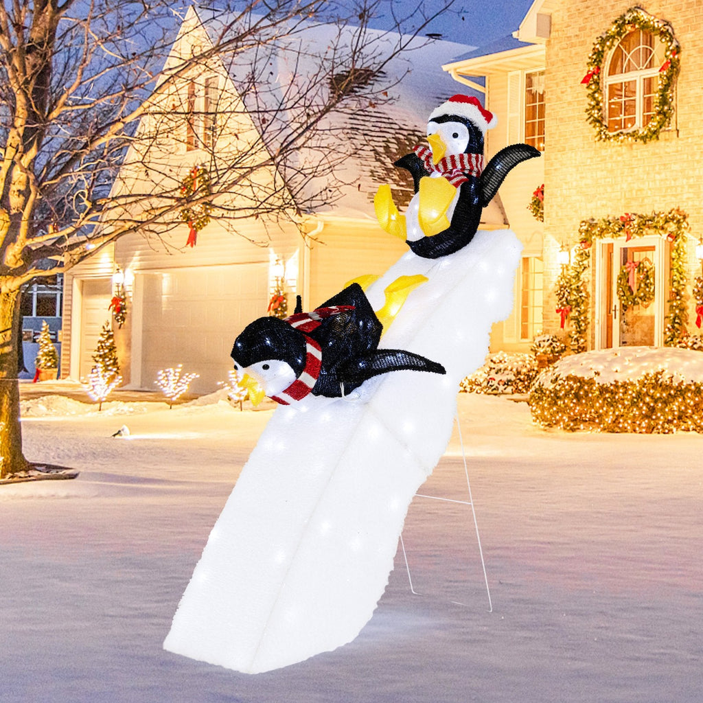 Décoration de Noël pingouin patineur avec toboggan enneigé de 1,20 m