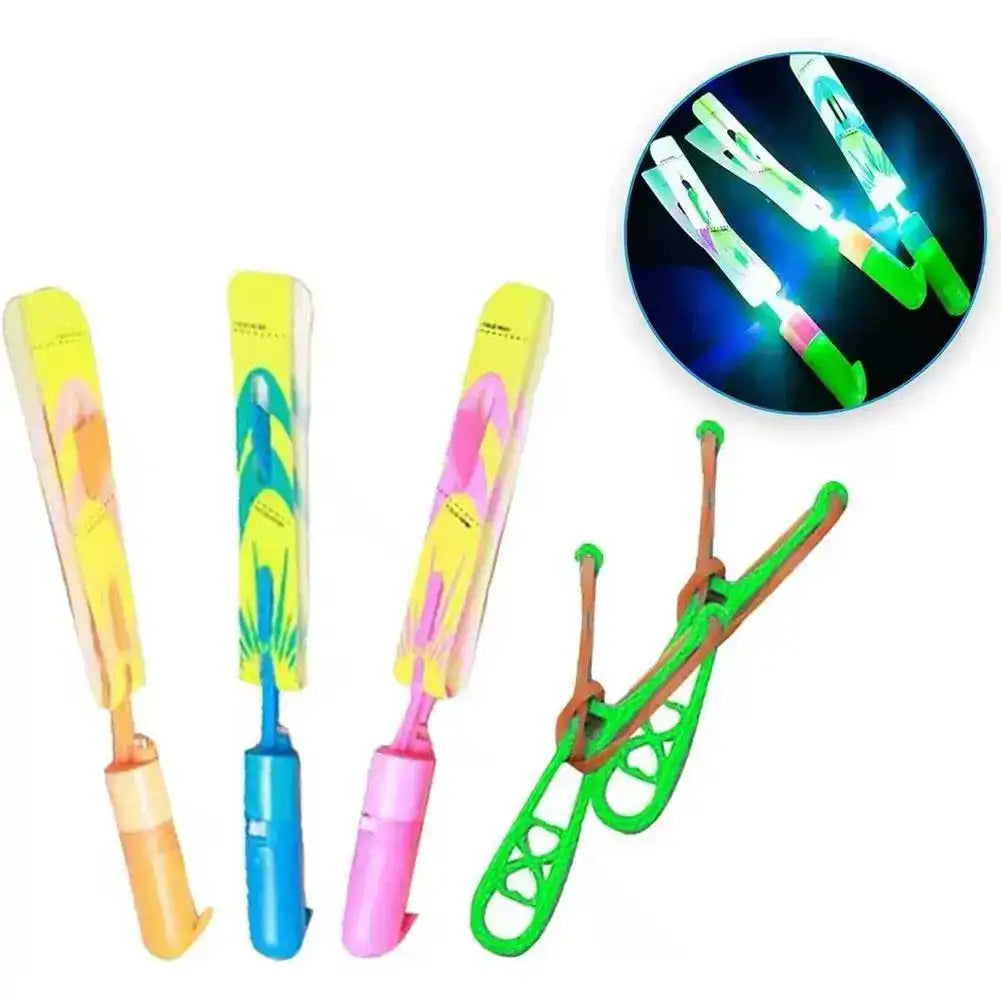 5 piezas de helicópteros voladores con luz LED tipo resortera, juguetes de cohete con flecha luminosa, recuerdos para fiestas al aire libre, helicópteros que brillan en la oscuridad para niños