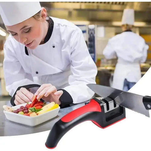 Red and black 3-stage knife sharpener on kitchen counter during knife sharpening