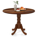 Mesa de comedor de madera con tablero redondo y patas caballete curvadas - Nogal